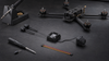DJI O4 Pro Air Unit beside a modular five-inch FPV quad on a workshop bench