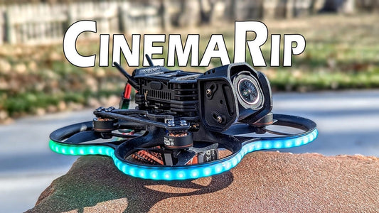 A BetaFPV Pavo20 Pro II micro FPV drone sitting on a blue work mat.