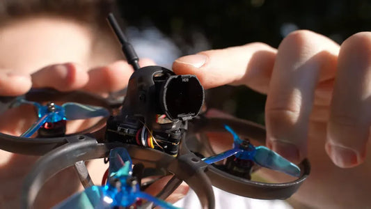 Close-up of the Happymodel Mobula 8 camera and ND filter.