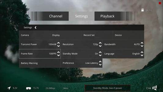 FPV on screen settings menu over a distorted green and pink tinted camera image illustrating a firmware bug