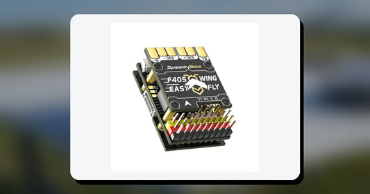 SpeedyBee F405 WING MINI fixed-wing flight controller on a workbench
