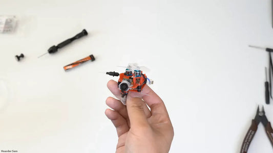 The world's smallest FPV drone, a 25g quad with a 22mm motor spacing.