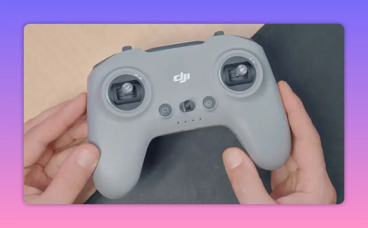 The Radiomaster T8L controller held in two hands, shown from a top-down perspective.