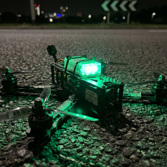An FPV drone flying over a green landscape with a clear sky.