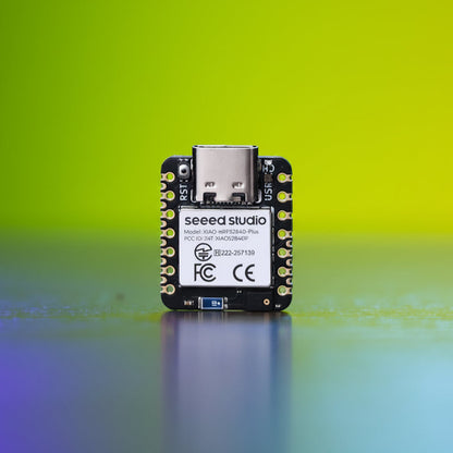 Electronic module with 'seeed studio' branding on a gradient blue background