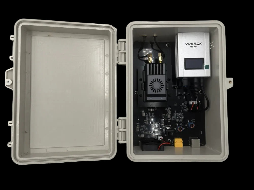 Open electronic box with VRX BOX device on a white background