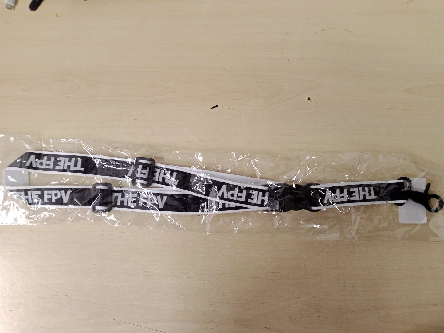 The FPV - The FPV Neckstrap (Battle-Scarred Edition)