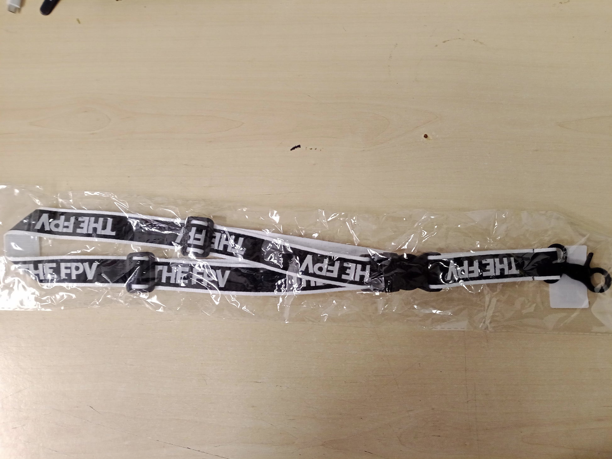 The FPV - The FPV Neckstrap (Battle-Scarred Edition)