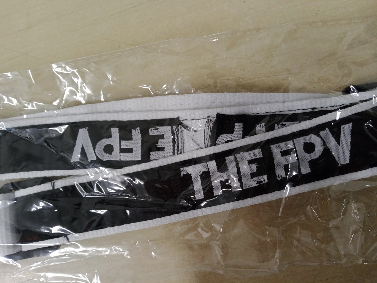 The FPV - The FPV Neckstrap (Battle-Scarred Edition)