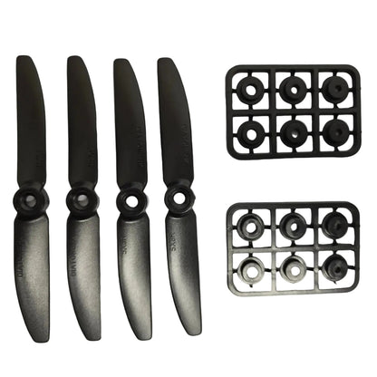 Four black propellers on a white background with two black metal grids.
