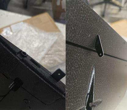 Close-up of a textured metal surface with a brand logo.