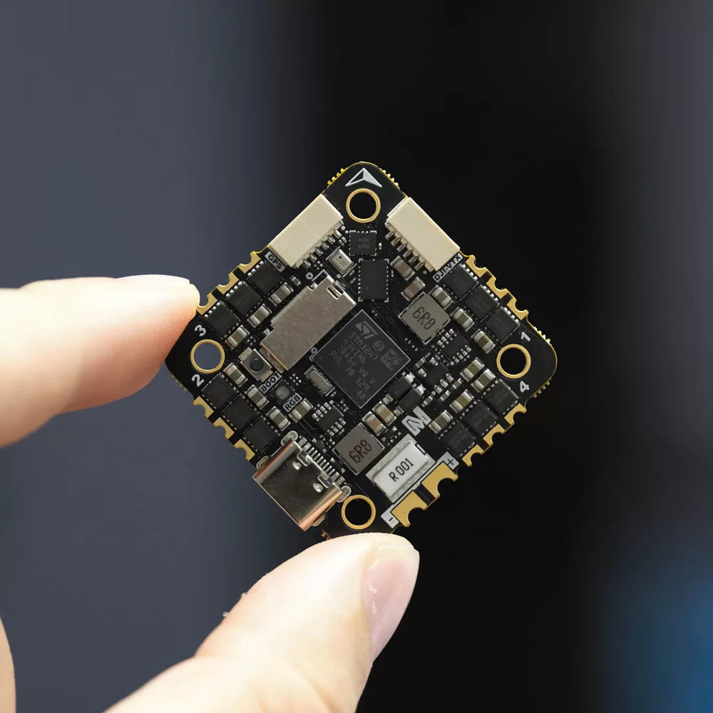 MicoAir743v2-AIO-35A board held for scale